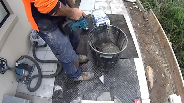 Instructions on How to Use a Hammer Drill to Mix Concrete