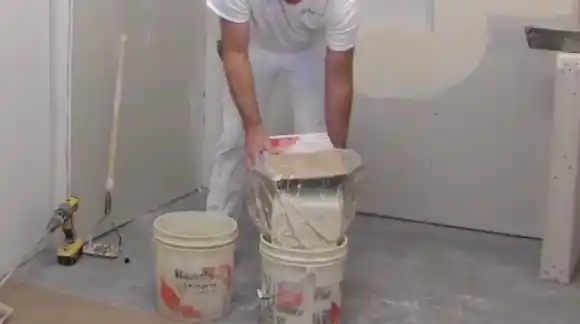 Pour the Drywall Mud Into the Bucket