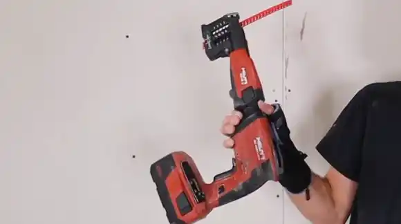 Drywall gun for a screw head