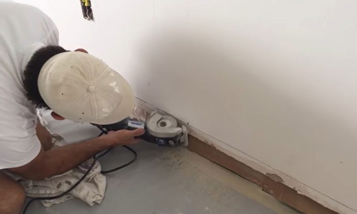 Circular saw cutting drywall