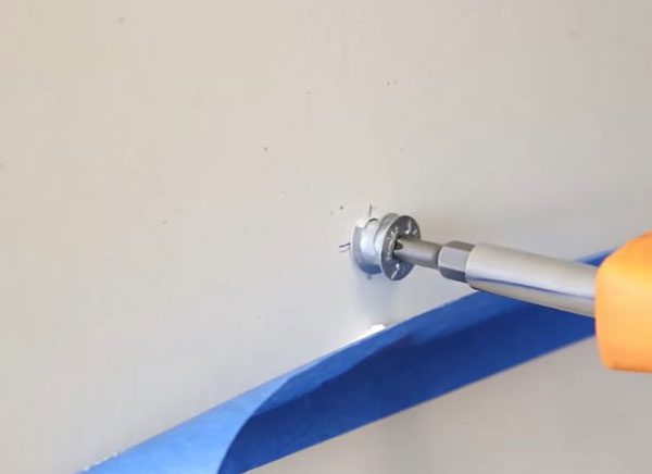 Installing drywall anchors in preparation for hanging heavy items