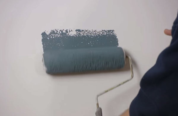 Paint roller on drywall