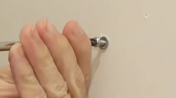 Preparation for removing screws from drywall anchors with toggle bolts