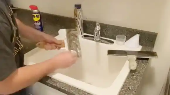Rinse Drywall Tools in the Sink Under Running Water