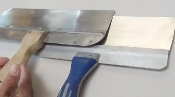 Scrape Out Irregularities with Taping Knife