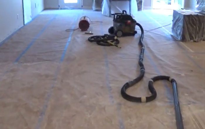 Vacuuming drywall dust