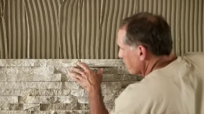 can you install stone veneer over cement board outside